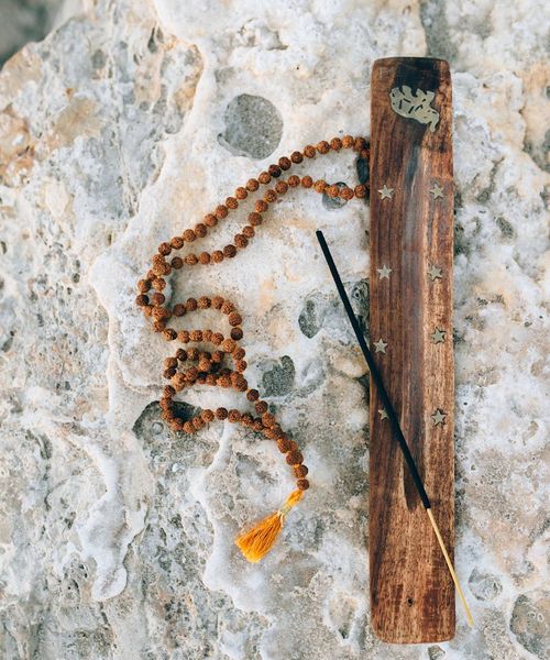 Silhouette of a person in a meditative state with lines indicating energy flow.